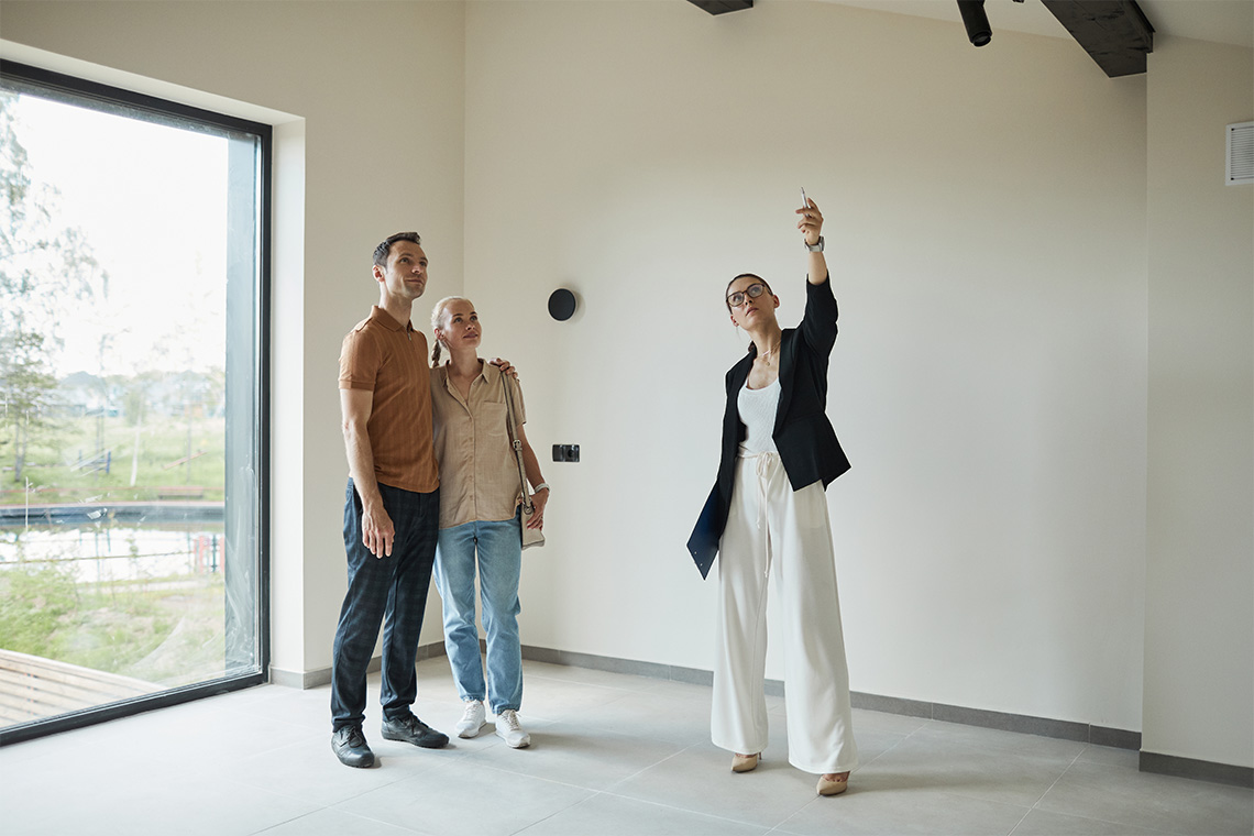 A Real Estate Agent Shows An Apartment To Tenants