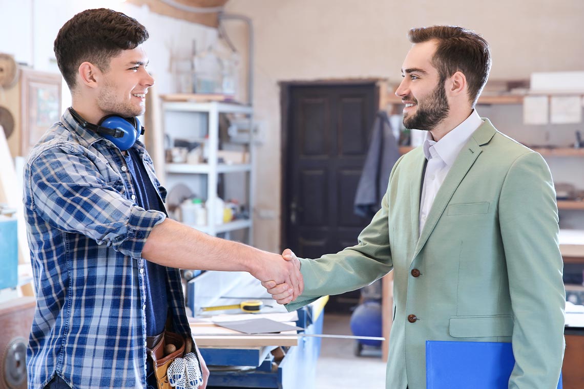 A Property Manager Handshakes The Handyman
